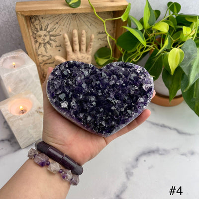Druzy Purple Amethyst Hearts Top view of choice number four with hand for size reference 