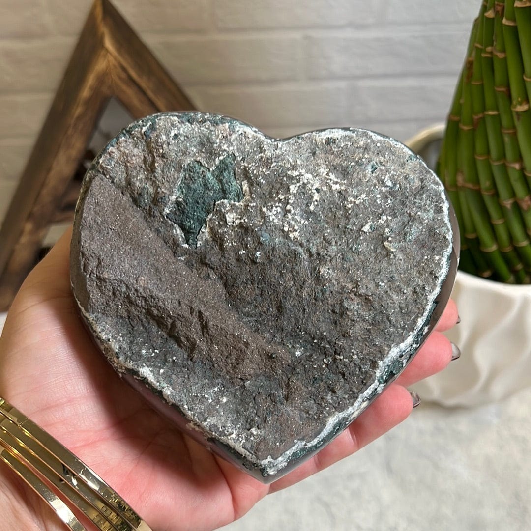 Backside of the heart showing it is gray and green rock.
