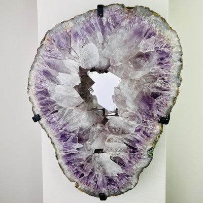 Frontal view of Amethyst Large Cluster Mirror, mounted on a wall