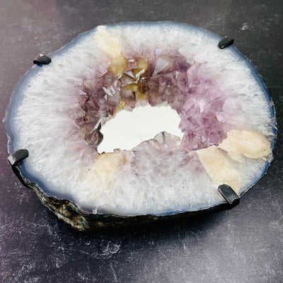 Top angle view of Amethyst Cluster Mirror with Calcite, laying on a flat surface