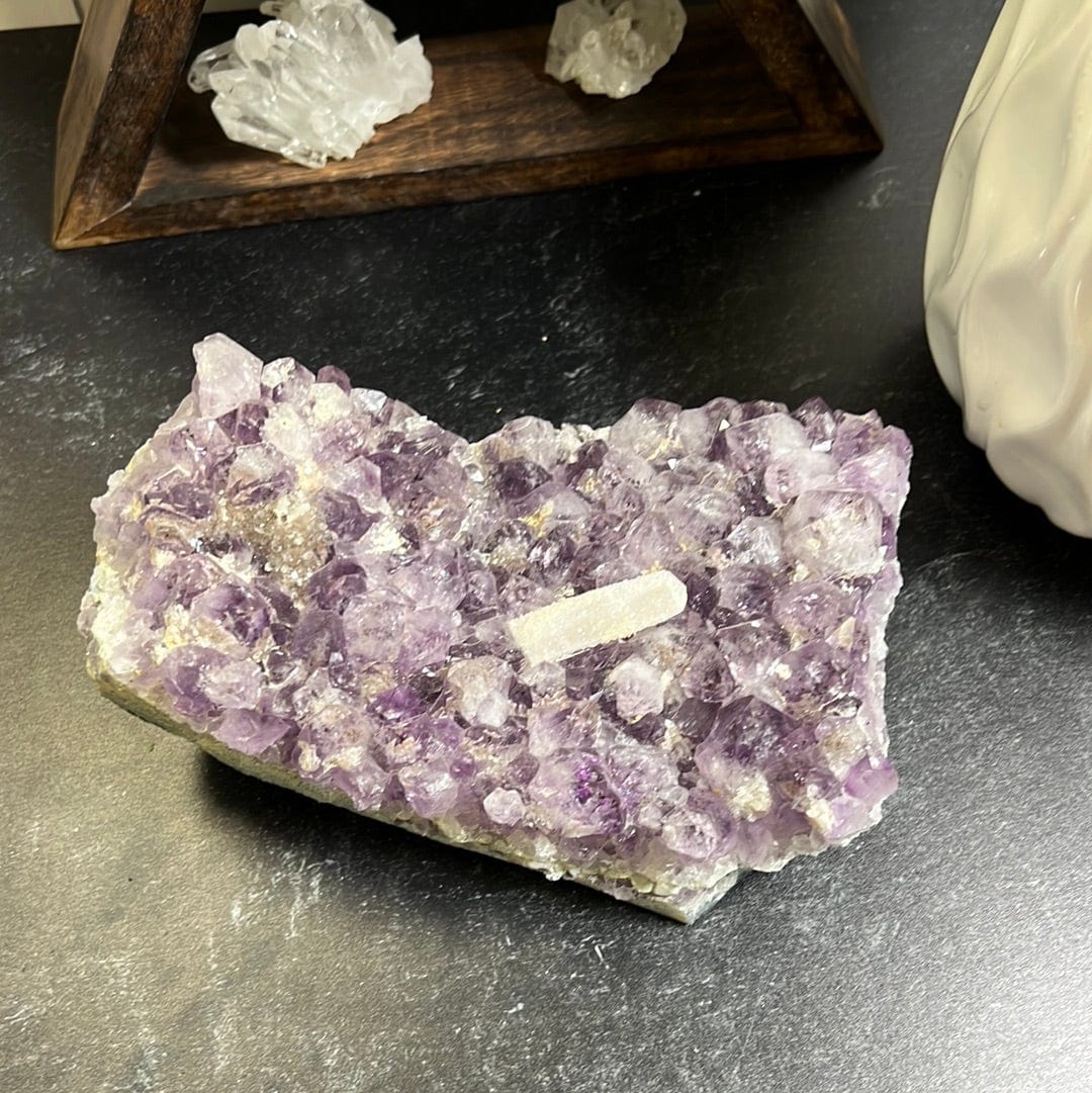Amethyst cluster large piece with a special druzy coated calcite rod in the middle of the clusters.