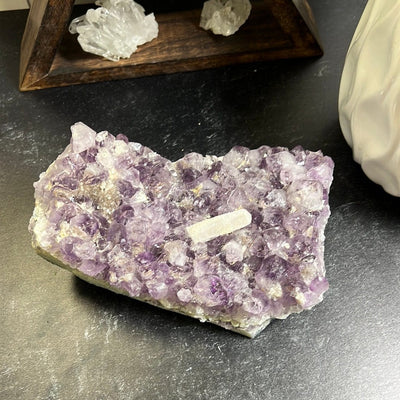Amethyst cluster large piece with a special druzy coated calcite rod in the middle of the clusters.