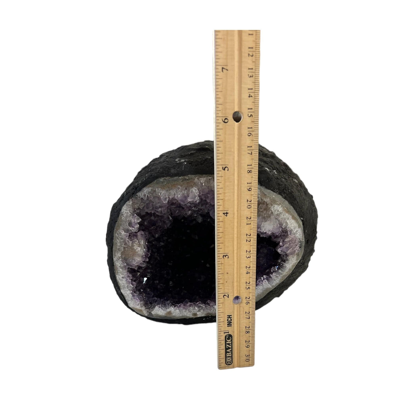 Round amethyst geode on a white background with a ruler showing it is around 5" tall.