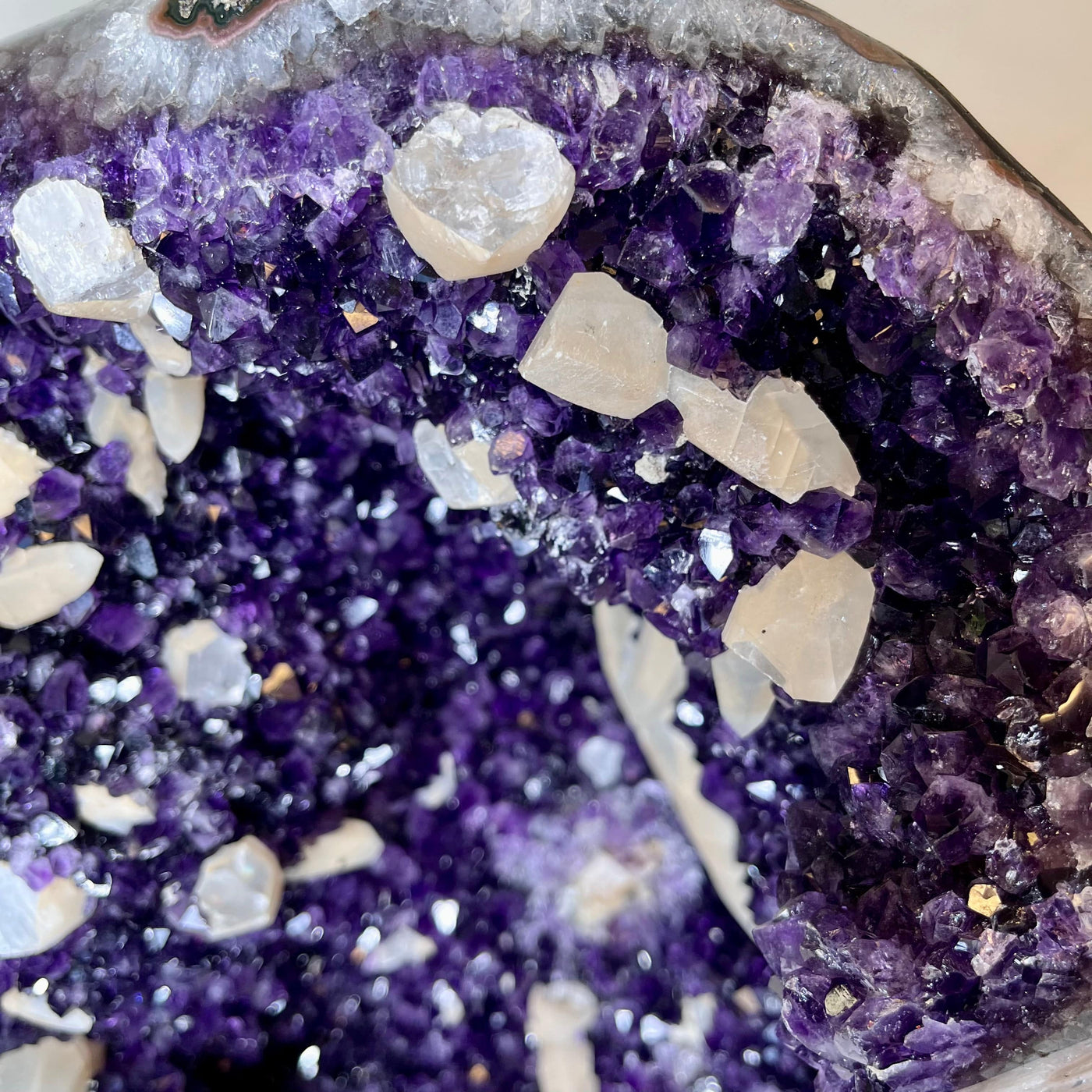 Up close view of crystal formations inside Large Dark Purple Amethyst and Calcite Geode.