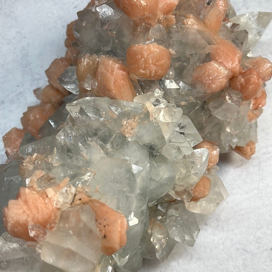close up of Large zeolite cluster with apophyllite and peach stillbite crystals 