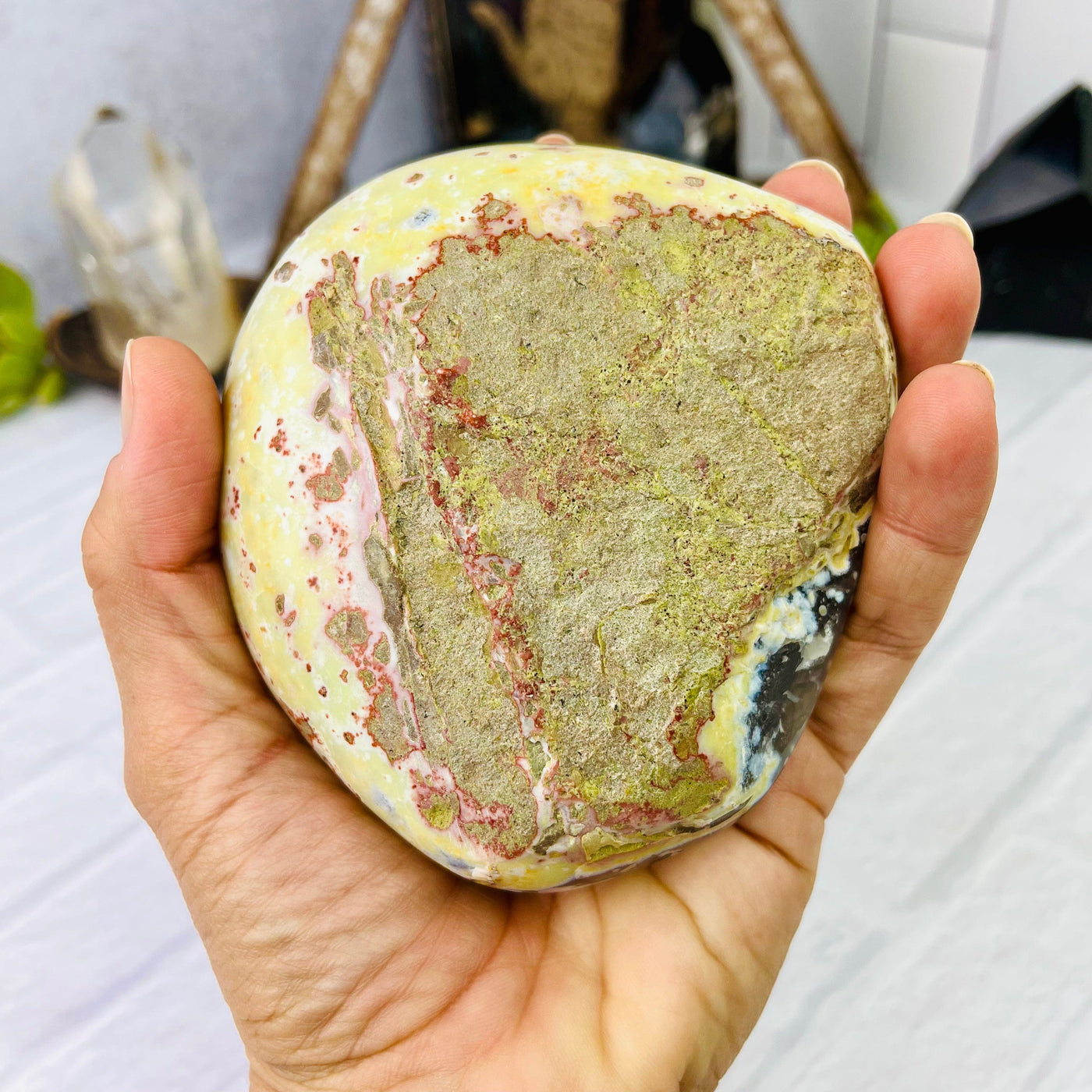 Bottom view of Speckled Agate Druzy Geode Box held in hand.