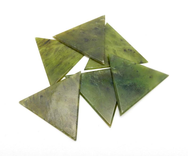 Nephrate Jade Triangle - 6 on a table