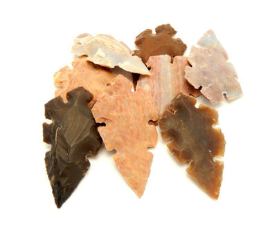multiple 2" jasper arrowheads on white background for thickness reference