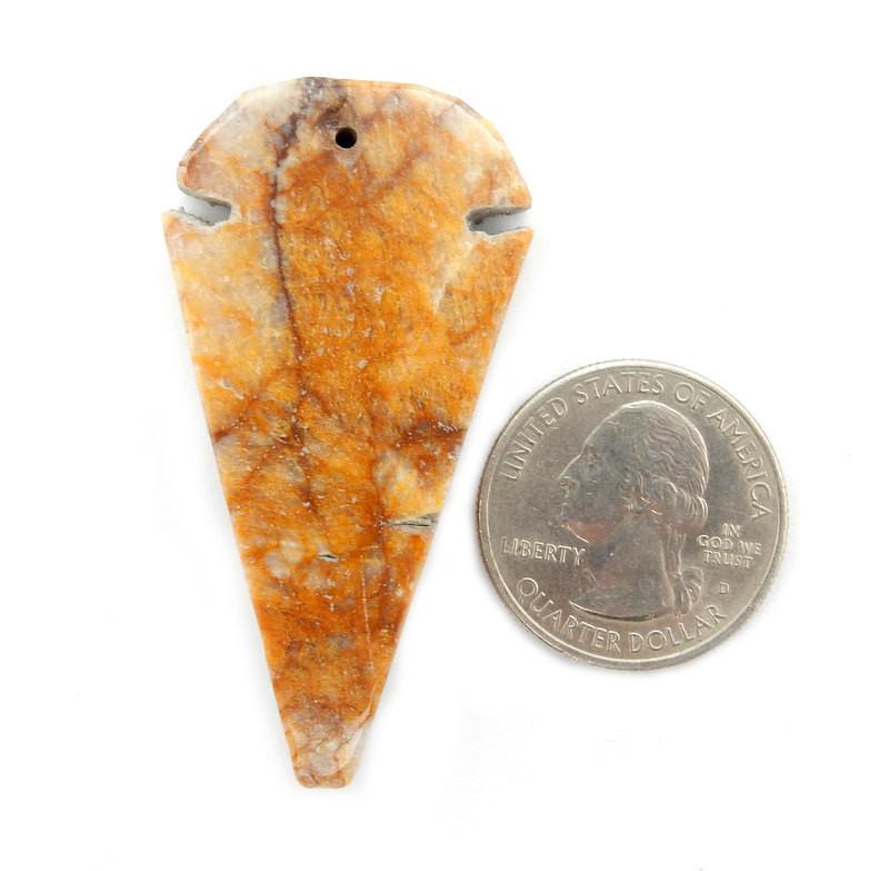 arrowhead next to a quarter for size reference 