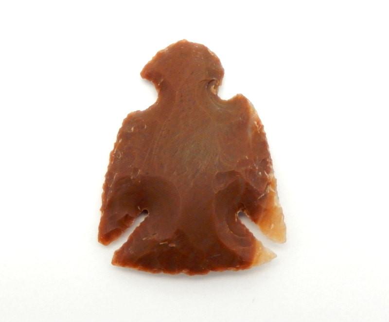 up close of the Eagle shaped Jasper Arrowhead on white background to show texture and colors
