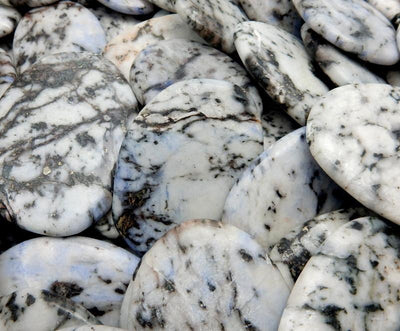 up close shot of pile of jasper worry stones
