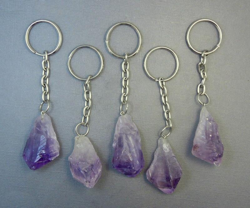 5  Amethyst Nugget Keychains in silver tone lined up on a table
