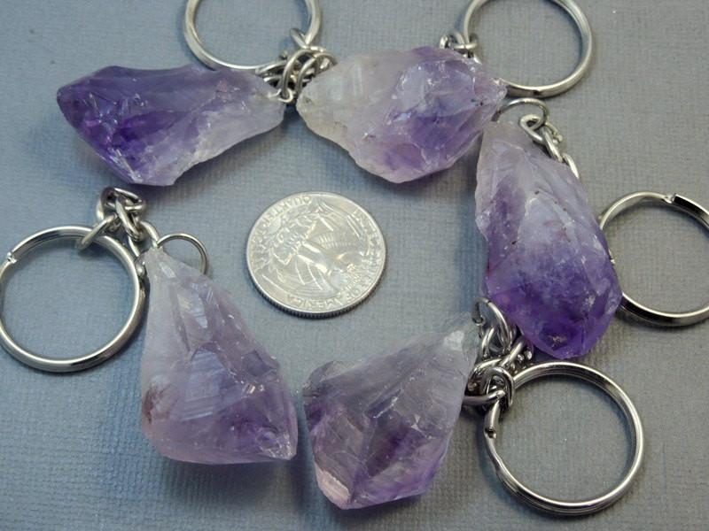 Amethyst Nugget Keychains around a quarter showing size reference