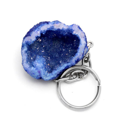 single colored half occo geode silver toned keychain shown against a white background