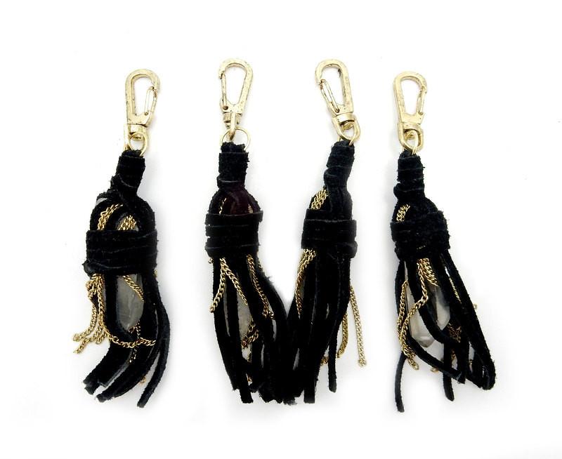 4 black Leather Keychains with Crystal Quartz Points on white background