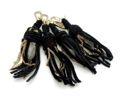 4 black Leather Keychains with Crystal Quartz Points on white background 