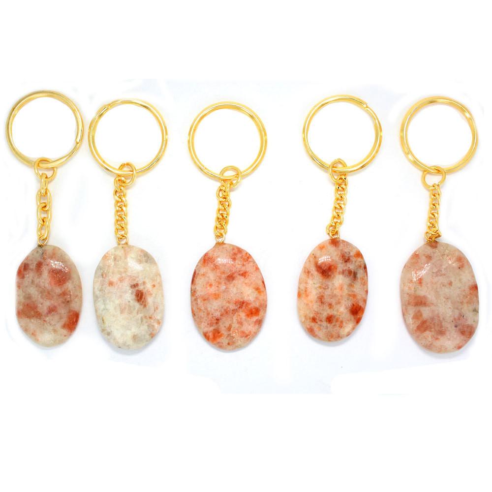 5 Sunstone Worry stone Keychains in a row with gold tone ring and chain