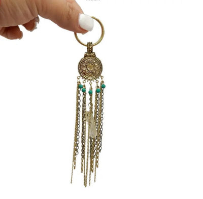 Gemstone Tassel Keychain with Antique Gold Chain and Crystal Quartz and Turquoise Howlite Dangles held in a hand for size reference