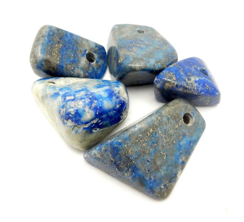 side view of multiple Tumbled lapis lazuli beads for thickness reference