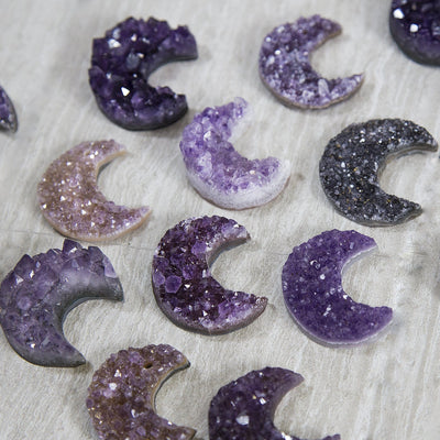 Amethyst cluster moons in assorted shades of purple to show how they vary.