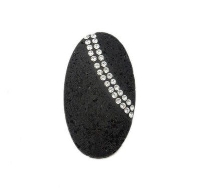 up close shot of oval lava rock bead with rhinestones on white background