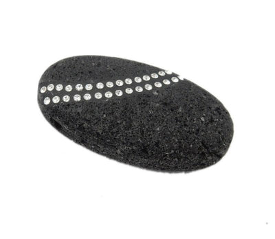 angled shot of oval lava rock bead with rhinestones on white background