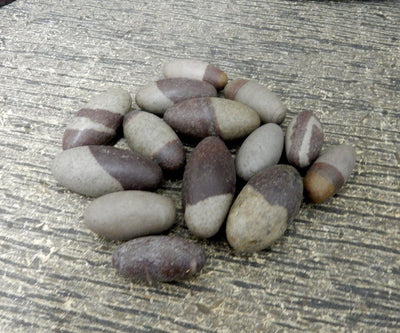 lingam stones on gray background