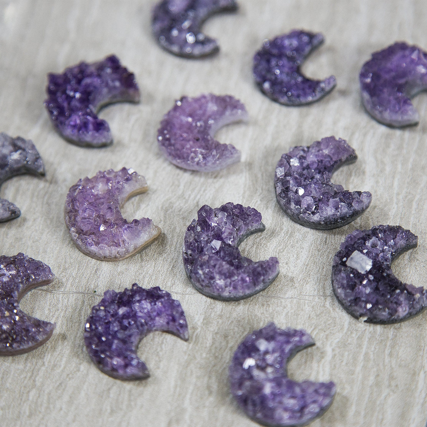 Amethyst cluster moons in assorted shades of purple to show how they vary.
