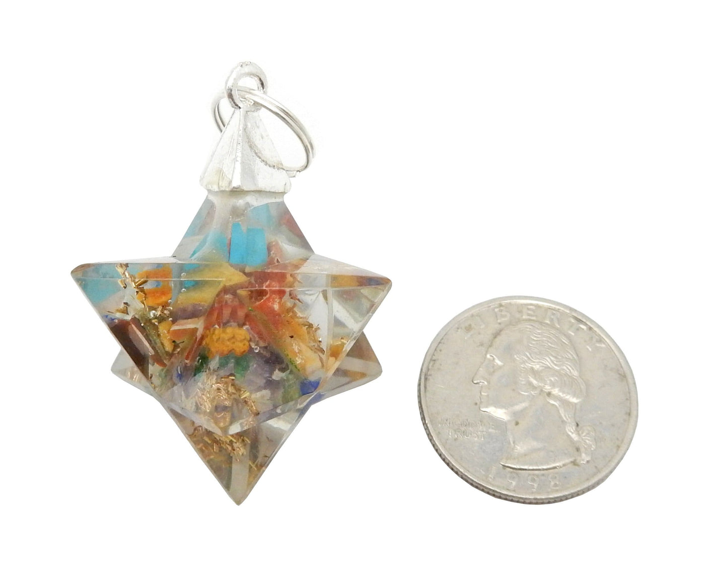 Merkaba - Merkaba Star Orgone Silver Toned Bail Pendant - multi colored next to a quarter