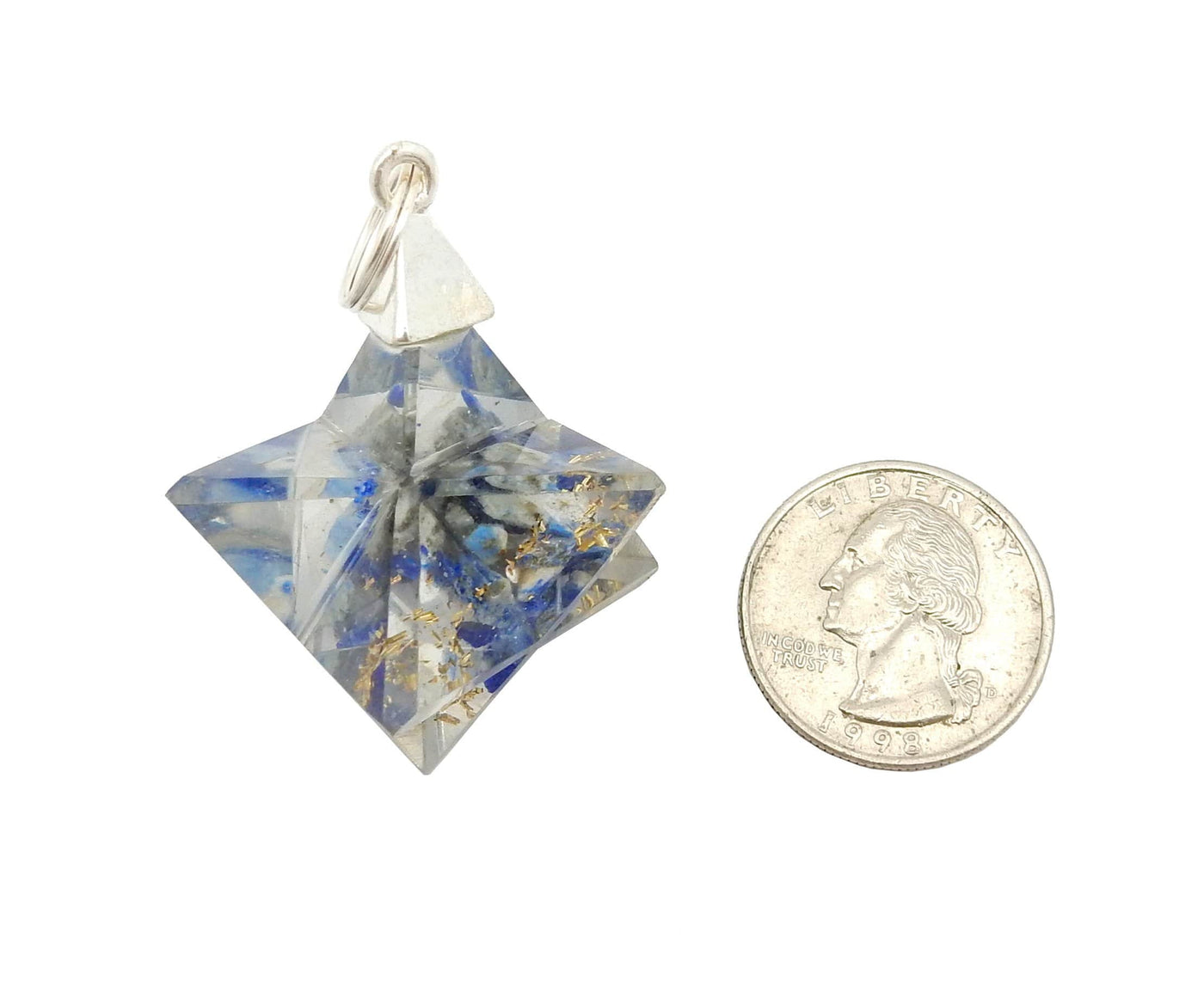 one merkaba star pendant next to a quarter