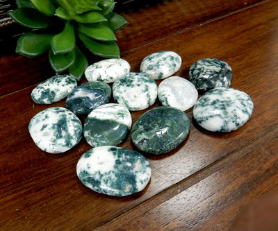 moss agate worry stones on a table