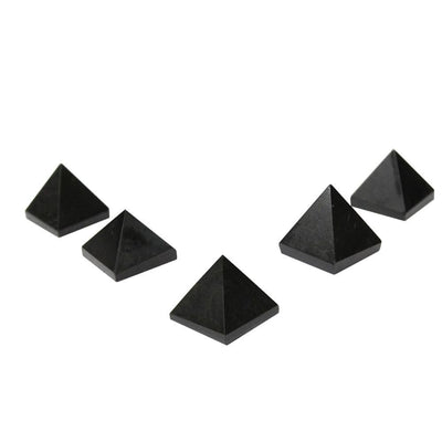 multiple black onyx pyramids displayed to show the slight differences in the sizes 