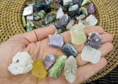 Assorted minerals in a hand.