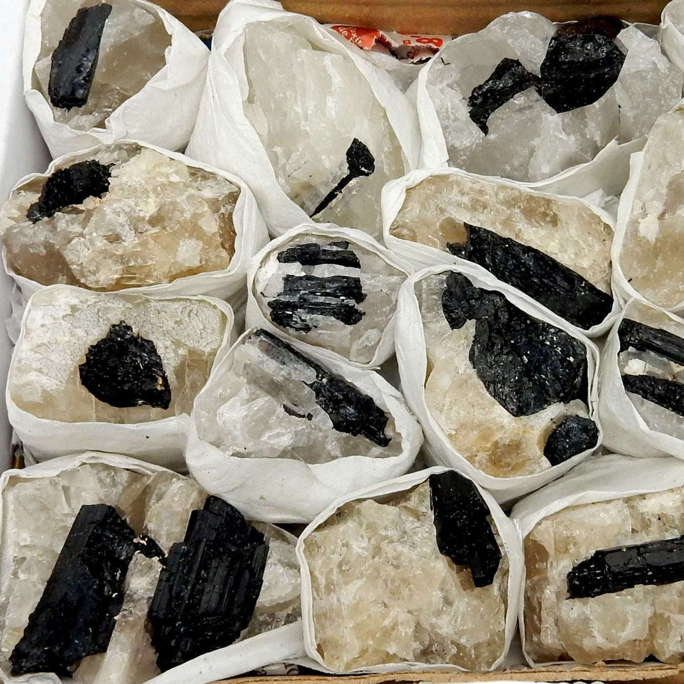 a bunch of Black Tourmaline on Matrix, showing varying shape and size stones