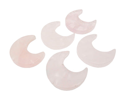 Five Rose Quartz Half Crescent Moons - Drilled, displayed on a white surface.