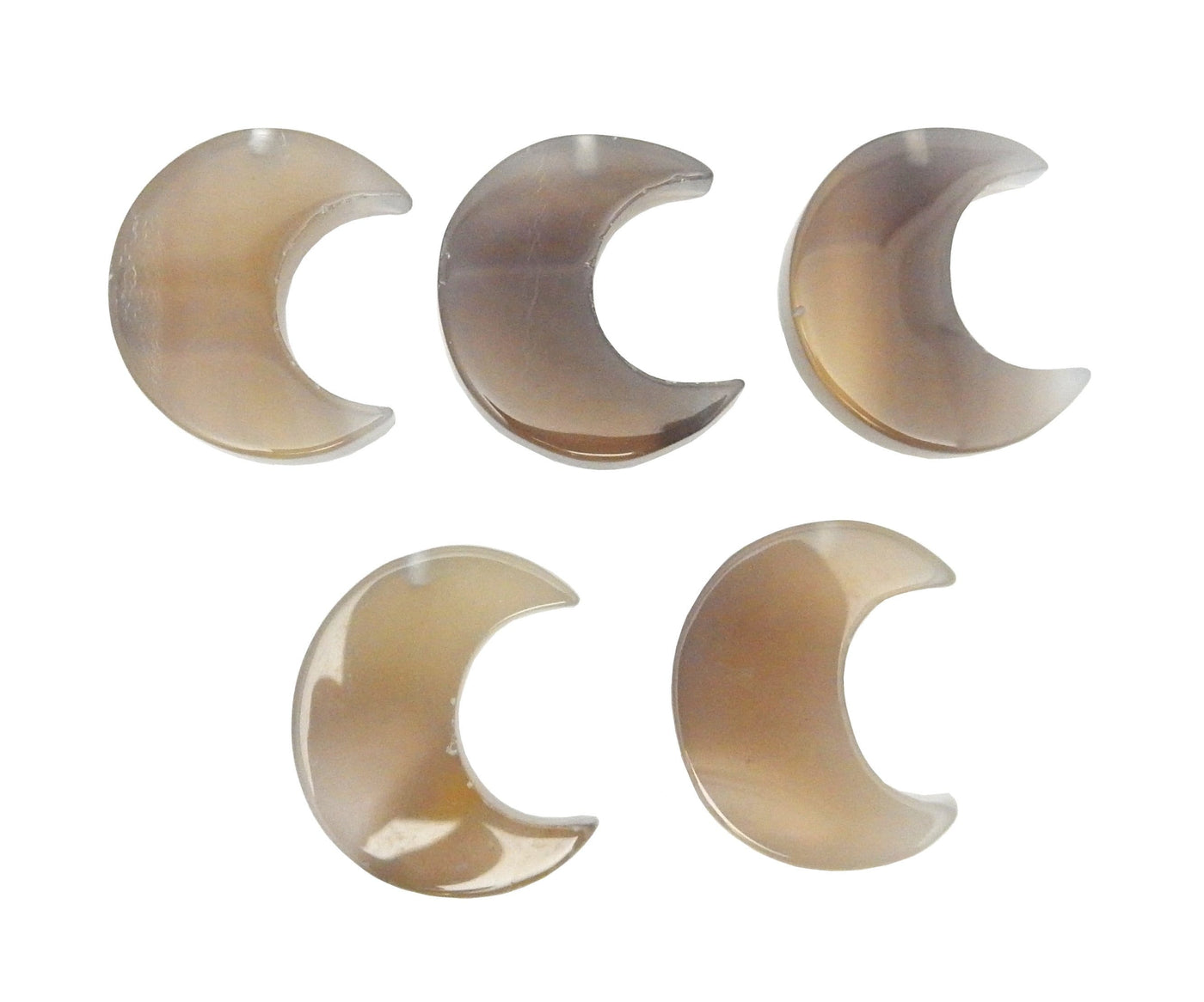 Five Chalcedony Half Crescent Moons - Drilled, displayed on a white surface.