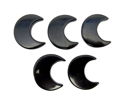 Five Black Obsidian Half Crescent Moons - Drilled, displayed on a white surface.