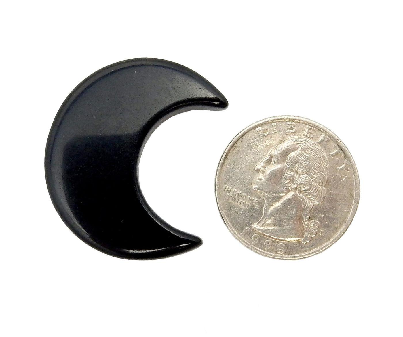 Black Obsidian Half Crescent Moon - Drilled displayed next to a quarter for size reference.