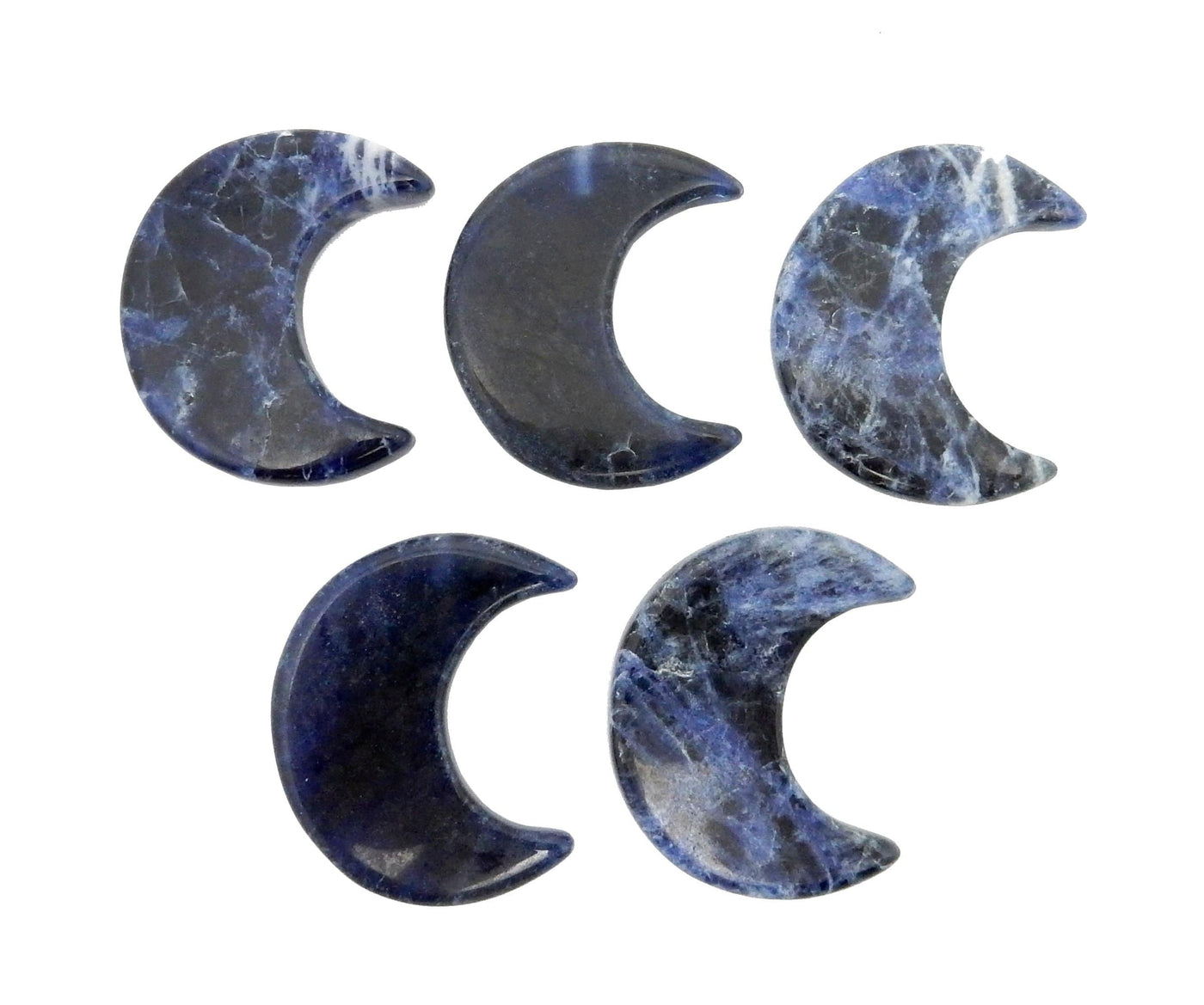 Five Blue Sodalite Half Crescent Moons - Drilled, displayed on a white surface.