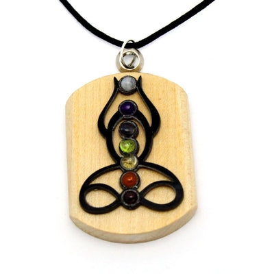 close up of seven chakra buddha pendant for details
