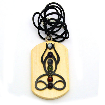 close up of seven chakra buddha pendant