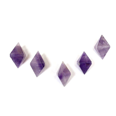 ONE (1) Amethyst Diamond Shaped Stone Point - 5 on a taable