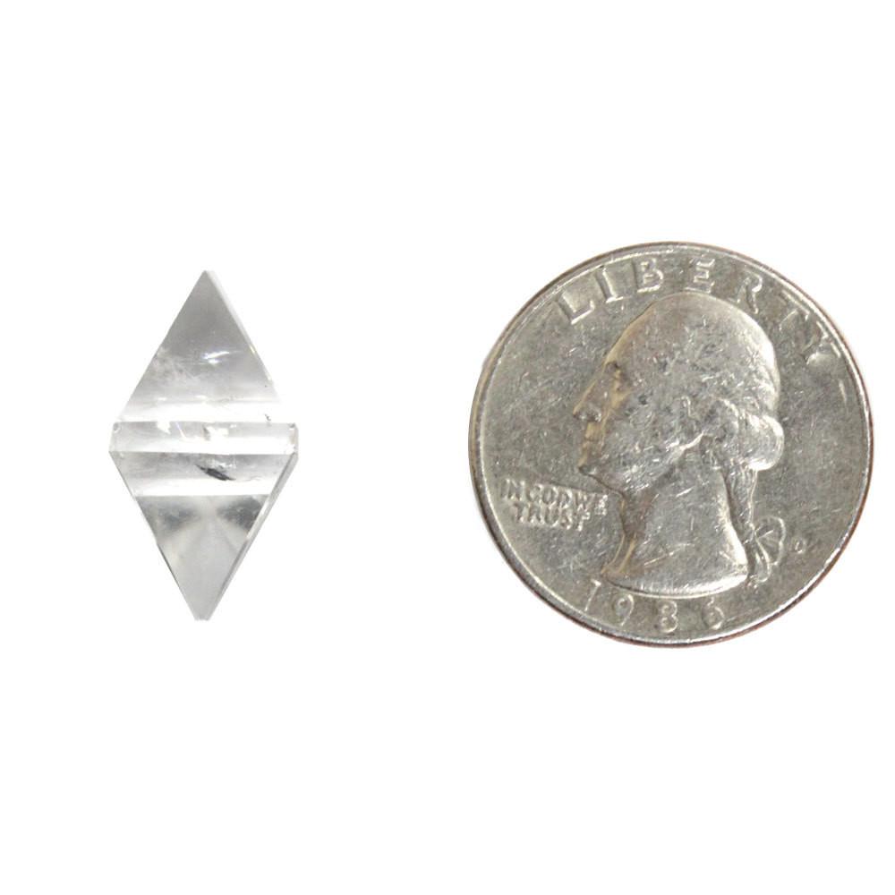 Crystal Quartz Diamond Shaped Stone Point displayed next to quarter for size reference 