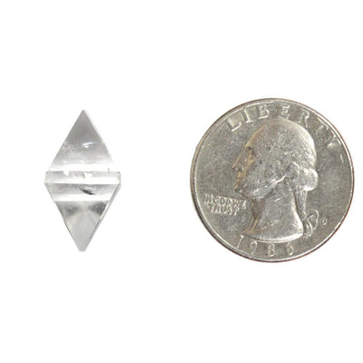 Crystal Quartz Diamond Shaped Stone Point displayed next to quarter for size reference 