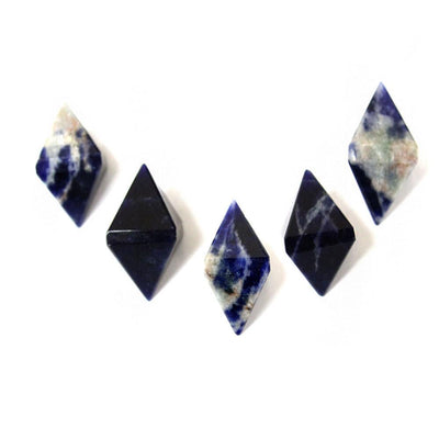 five sodalite diamond shaped points on white background for possible variations