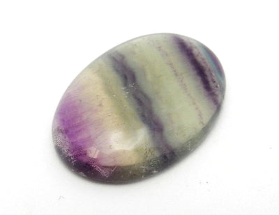 Oval Fluorite displayed on white background