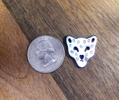 Pearl Drilled Bead displayed next to quarter for size reference