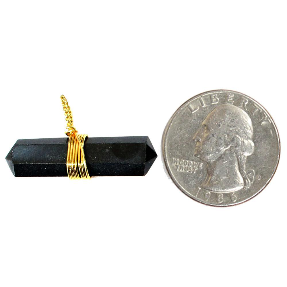 Quarter comparing size to the black agate pendant  with gold wire 