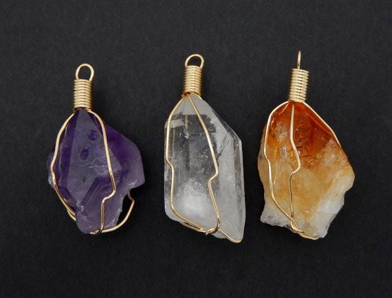 multiple crystal pendants displayed to show the differences in the crystal types 