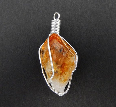 close up of the citrine wire wrapped pendant in silver 